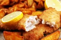 Traditional British fish and chips consisting of fried fish, potato chips and mayonnaise