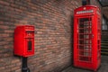 The traditional British public red mailbox and telephone kiosk or booth Royalty Free Stock Photo