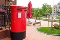 Traditional british red post box on street. Royalty Free Stock Photo