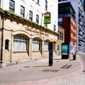 Traditional Britsh Pub Or Public House House Next To A New Development Of High Rise Residential Apartments