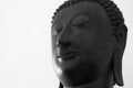 Traditional Buddha head against a white background with copy space. Royalty Free Stock Photo