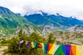 Traditional buddhist prayer flags over foggy mountain background in Ngawal, Nepal