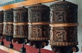 Traditional Buddhist prayer wheels with mantras. Royalty Free Stock Photo