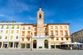 Traditional building with clock and bell tower on Piazza Tre Martiri Three Martyrs square in old historical city centre Rimini