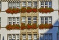 Traditional building with flowers on the balcony in Munich, Germany Royalty Free Stock Photo