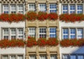 Traditional building with flowers on the balcony in Munich, Germany Royalty Free Stock Photo