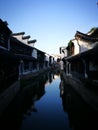 Traditional buildings reflecting on peaceful river Royalty Free Stock Photo