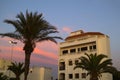 Traditional built apartments with palm trees at the boulevard of Assilah