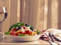 Traditional Bulgarian dish, Shopsky salad, with vegetables and cheese, on a white background, no people, horizontal,