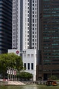 A traditional bumboat on the Singapore River with modern office buildings in the background Royalty Free Stock Photo