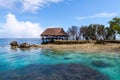 Traditional bungalow of native aborigines Micronesian people. Reef coral island motu. Blue azure turquoise lagoon. Pohnpei island. Royalty Free Stock Photo