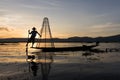 Traditional Burmese fisherman at Inle lake, Myanmar famous for their distinctive one legged rowing style Royalty Free Stock Photo