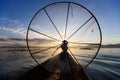 Traditional Burmese fisherman at Inle lake, Myanmar famous for their distinctive one legged rowing style Royalty Free Stock Photo