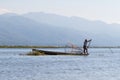 Traditional Burmese fisherman at Inle lake, Myanmar famous for their distinctive one legged rowing style Royalty Free Stock Photo