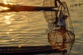 Traditional Burmese fisherman at Inle lake, Myanmar famous for their distinctive one legged rowing style Royalty Free Stock Photo