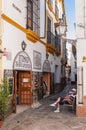 Traditional cafeteria on the narrow street of Seville in Spain