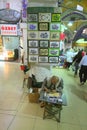 Traditional calligrapher at work in market