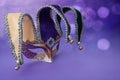 Traditional carnival mardi gras mask on table .Masquerade mask on glitter background. Mardi Gras