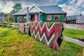 Traditional Carpathian handmade carpets made of goat wool. Old wooden hous in the Snidavka village.