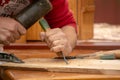 Traditional carpenter close up working hands with carpeting tools.