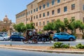 A traditional carriage karozzin is pulled by a horse Royalty Free Stock Photo