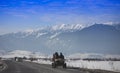 Traditional cart with horses on the winter road.