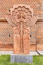 traditional carved khachkar made of pink stone installed in the Etchmiadzin complex near the