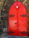 Traditional castle or fortress door closed and painted bright red Royalty Free Stock Photo