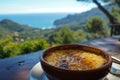 Traditional Catalan Cream Dessert with Serene Mediterranean Seascape View for Travel and Cuisine Concepts