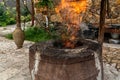 Traditional Caucasian wood-burning stone-brick tandoor oven for cooking shish kebab, fish, pita bread