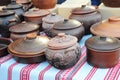 Traditional ceramic jugs on decorative towel. Showcase of handmade ceramic pottery