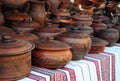 Traditional Ceramic Jugs on Decorative Towel. Showcase of Handmade Ukraine Ceramic Pottery Royalty Free Stock Photo