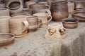 Traditional Ceramic Jugs of Handmade Ceramic Pottery in a Roadside Market with Ceramic Clay Caps Outdoors