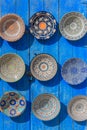 Traditional ceramic Oriental kitchenware on the wall of the Bazaar of Morocco. Royalty Free Stock Photo