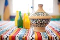 traditional ceramic tagine pot on patterned tablecloth