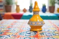 traditional ceramic tagine pot on patterned tablecloth
