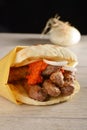 Traditional cevapcici in lepinja bread/Balkan food Royalty Free Stock Photo