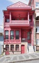 Traditional charming pink house with wooden balcony, located on a quiet street in Uskudar, Istanbul, Turkey
