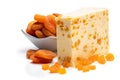 Traditional cheddar cheese with dry apricot isolated on white Royalty Free Stock Photo