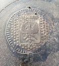 Traditional Chernihiv manhole cover or drain lid with the city two head eagle symbol Royalty Free Stock Photo