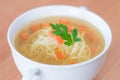 Traditional chicken broth soup served in a white bowl. Royalty Free Stock Photo