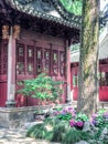 Traditional chinese building with ornate roof and red windows at Yu Gardens, Shanghai, China Royalty Free Stock Photo