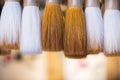 Traditional Chinese calligraphy brushes hanging in a shop Royalty Free Stock Photo