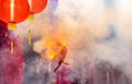 Traditional Chinese firecrackers are exploding with flashes and smoke in Lunar new year Royalty Free Stock Photo