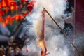 Traditional Chinese firecrackers are exploding with flashes and smoke in Lunar new year Royalty Free Stock Photo