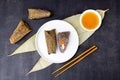 Traditional Chinese food for Dragon boat festival. Closeup zongzi or sticky rice dumpling on dark background with copy Royalty Free Stock Photo