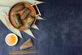 Traditional Chinese food for Dragon boat festival. Closeup zongzi or sticky rice dumpling on dark background with copy Royalty Free Stock Photo