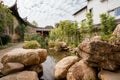 Traditional Chinese garden, a tourist attraction at Wolong College in Changting city, with ancient wood buildings, stones, and sma