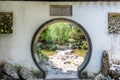 Traditional Chinese garden white round entrance.