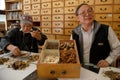 Traditional Chinese herbalist and assistant prepare herbs for customer Chinatown, Oakland, CA